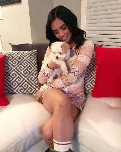 Picture of Louriza and her dog.